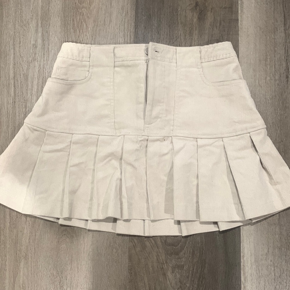Never worn before and in very good condition. The color is tan